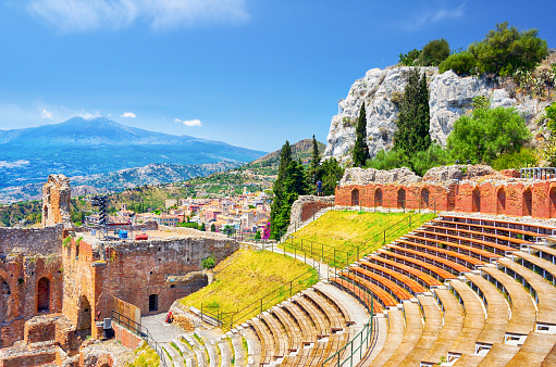 The Greco-Roman amphitheatre at Taormina with Mt.Etna in background, Sicily, Italy