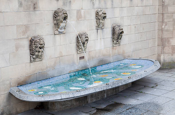 Fountain near Notre Dame cathedral in Luxembourg Fountain near Notre Dame cathedral in Grand Duchy of Luxembourg notre dame cathedral of luxembourg stock pictures, royalty-free photos & images