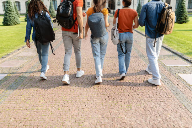 istock Group of students walking in college campus after classes, rear view 1781712833