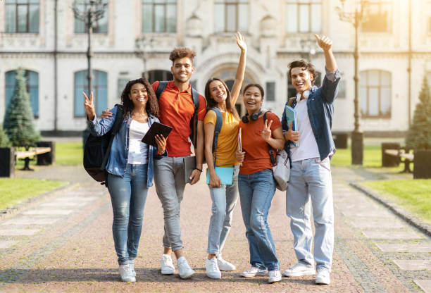 istock Studentship Concept. Group Of Happy Multiethnic Students With Workbooks Posing Together Outdoors 1781712885