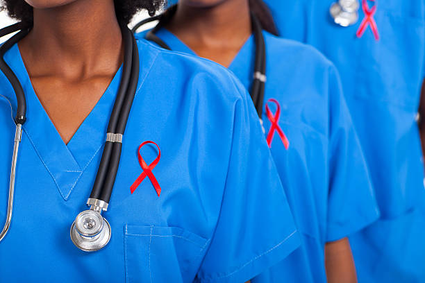 african medical doctors with red ribbon stock photo