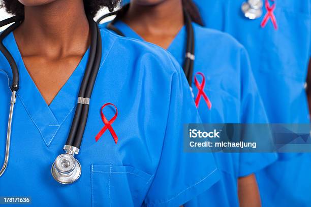 African Medical Doctors With Red Ribbon Stock Photo - Download Image Now - AIDS, HIV, Doctor