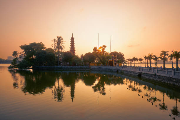 West lake and water reflection of temple in Hanoi West lake and water reflection of Tran Quoc Pagoda - the oldest Buddhist temple in Hanoi at twilight, Vietnam. west lake stock pictures, royalty-free photos & images