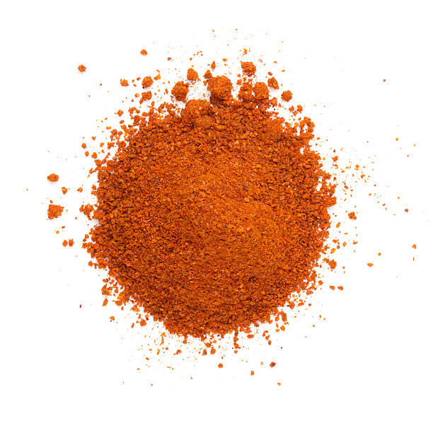 Heap ground paprika isolated on white background stock photo