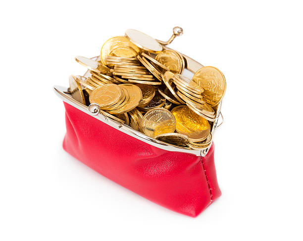 istock Red purse full of gold coins on a white 178173315