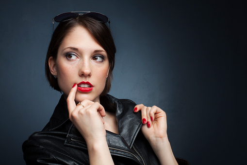 Beautifull young woman on gray background