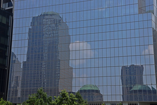 Reflection in a glass skyscraper in Manhattan's Financial District