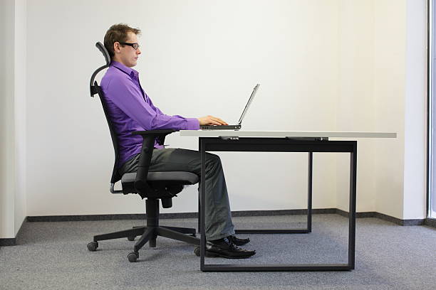 istock correct sitting position at laptop in ofice 178174415