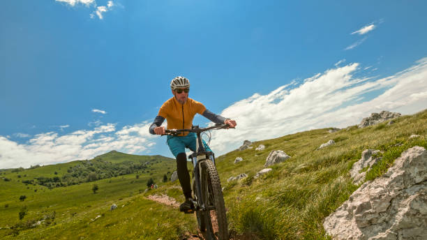 istock Mature man mountain biking 1781745444
