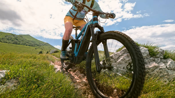 istock Mature woman mountain biking on grass 1781745446