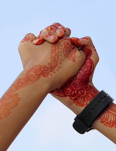 istock Arm wrestling with henna tinted hand 178174719