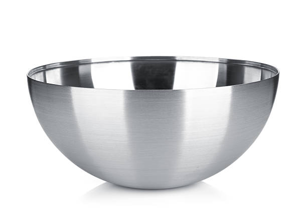 Stainless steel bowl Stainless steel bowl. Isolated on white background salad bowl photos stock pictures, royalty-free photos & images