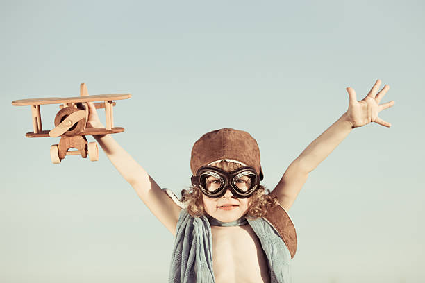 istock Happy kid playing with toy airplane 178176228