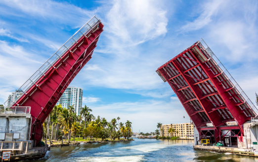 Open Drawbridge in Miami Florida at North Wste 17 Avenue for a passing Yacht in a clear day.
