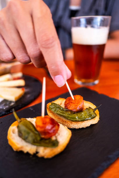 istock Someone has a tapa and a beer in Spain 1781763451