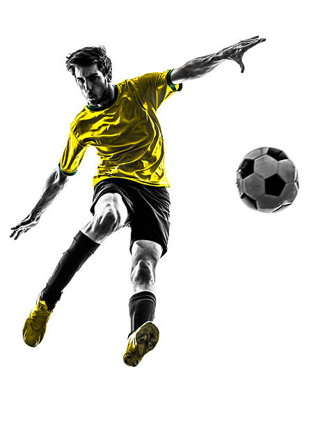 istock Soccer player kicking ball on white background 178177893