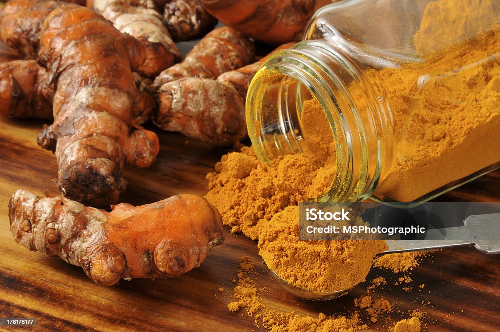 Fresh turmeric Fresh turmeric root, and ground spice - shallow depth of field Instrument of Measurement Stock Photo