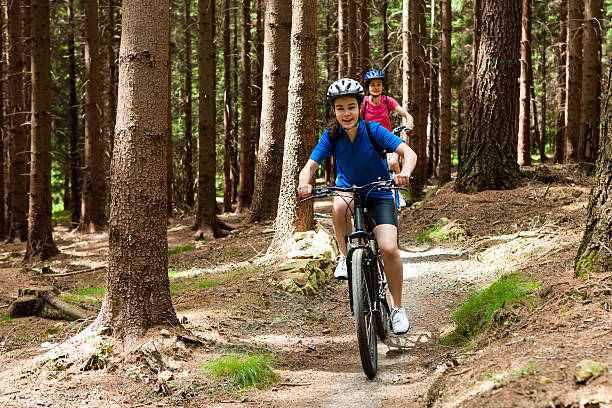 istock Two women riding bikes on forest trails 178178180