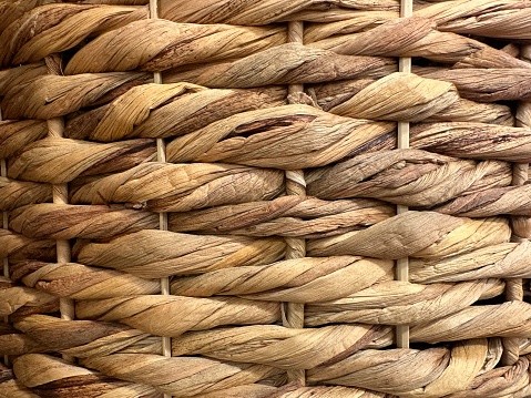 Handmade straw bags for shopping in a street market, Spain. Close-up.