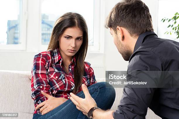 Quarreled Couple In Their Living Room Stock Photo - Download Image Now - Adult, Adults Only, Anger