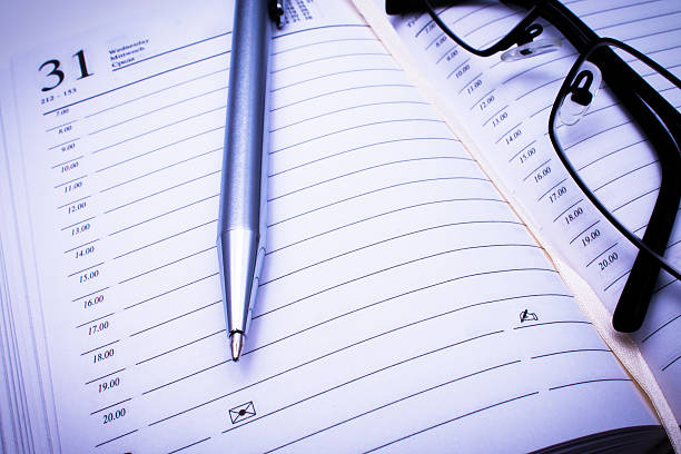 istock Address book, pen & black glasses 178181507