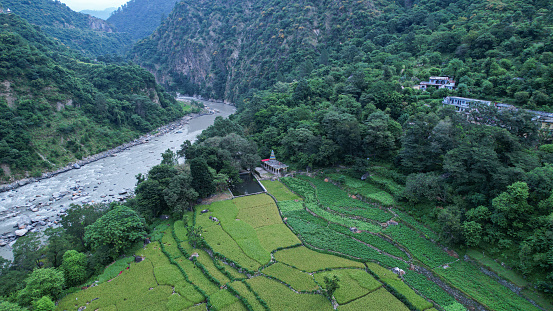 Aerial view of an epic highland landscape with a valley and the large river in Uttarakhand.serene mountain landscape
