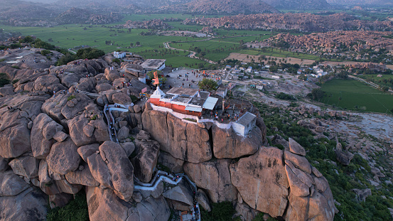 Hindu temple on top of Anjanadri Hill amidst rocky mountains and in natures lap during the spring season