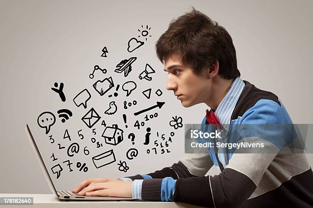 Young Man Using Laptop Stock Photo - Download Image Now - Adult, Computer, Computer Graphic