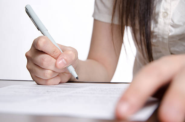 istock business women endorse on paper contract 178183278