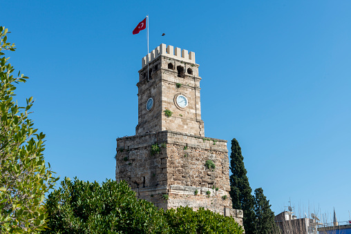 Clock Tower or Saat Kulesi in the centre of Antalya old town or Kaleici in Turkey