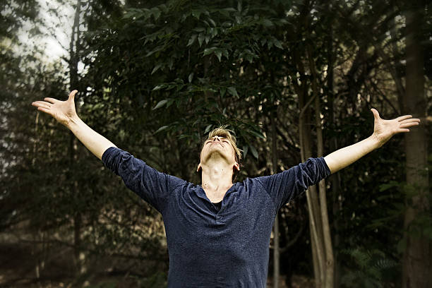 istock Man Extending Arms in Salutation Yoga Pose 178185086