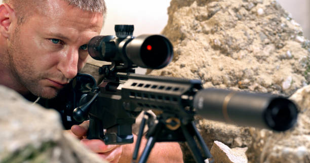 istock Soldier firing machine gun during battle 1781852796