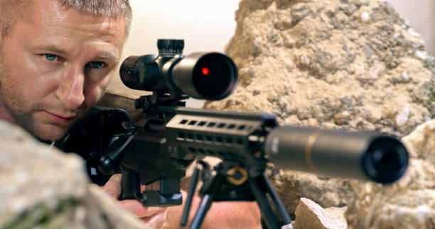 istock Soldier firing machine gun during battle 1781852804