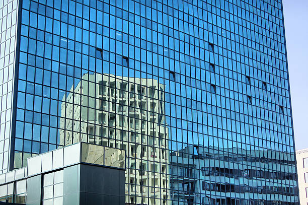 istock reflected in the windows of an office building 178186334