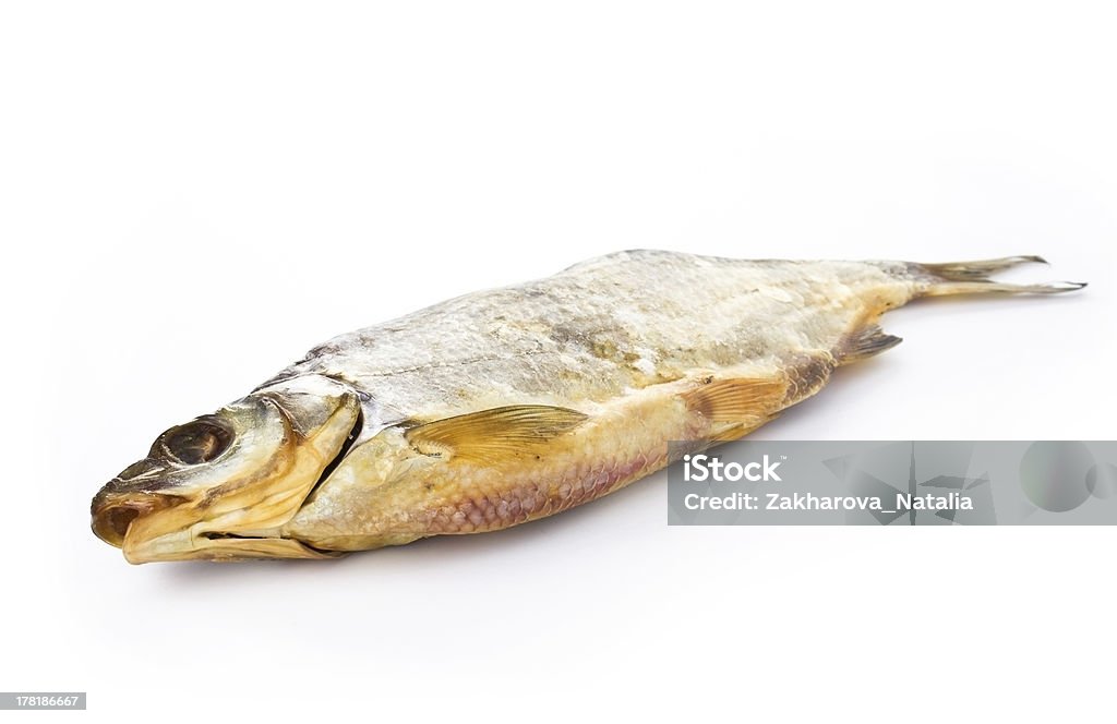 Dried fish on a white background Dried tasty fish on a white background Animal Fin Stock Photo