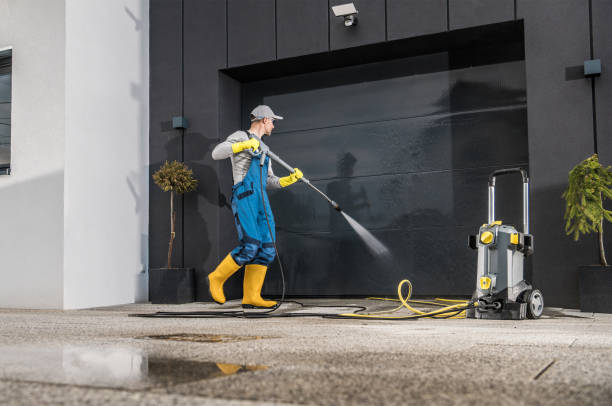 istock Men Pressure Washing His Garage Gate 1781872261