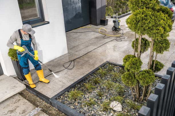 istock Men Pressure Washing House Surrounding Concrete Elements 1781872947