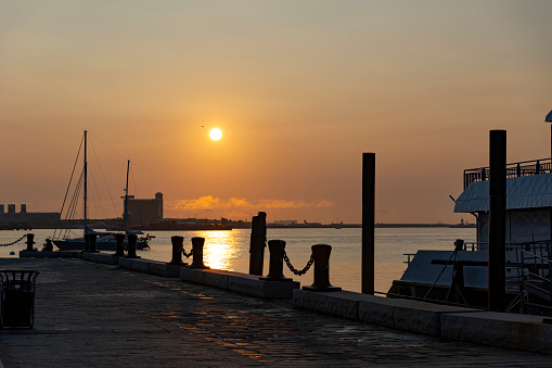 Boston Harbour near Long Wharf in the Financial District in Boston.  This is taken as the sun rises over Logan Airport.