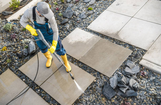 istock Homeowner Washing Out Dirt From His Garden Concrete Paths Using Pressure Washer 1781876304