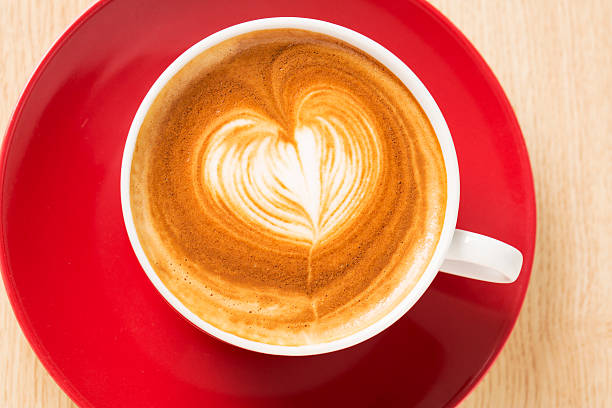 istock Zoomed cup of coffee with foam heart 178188026