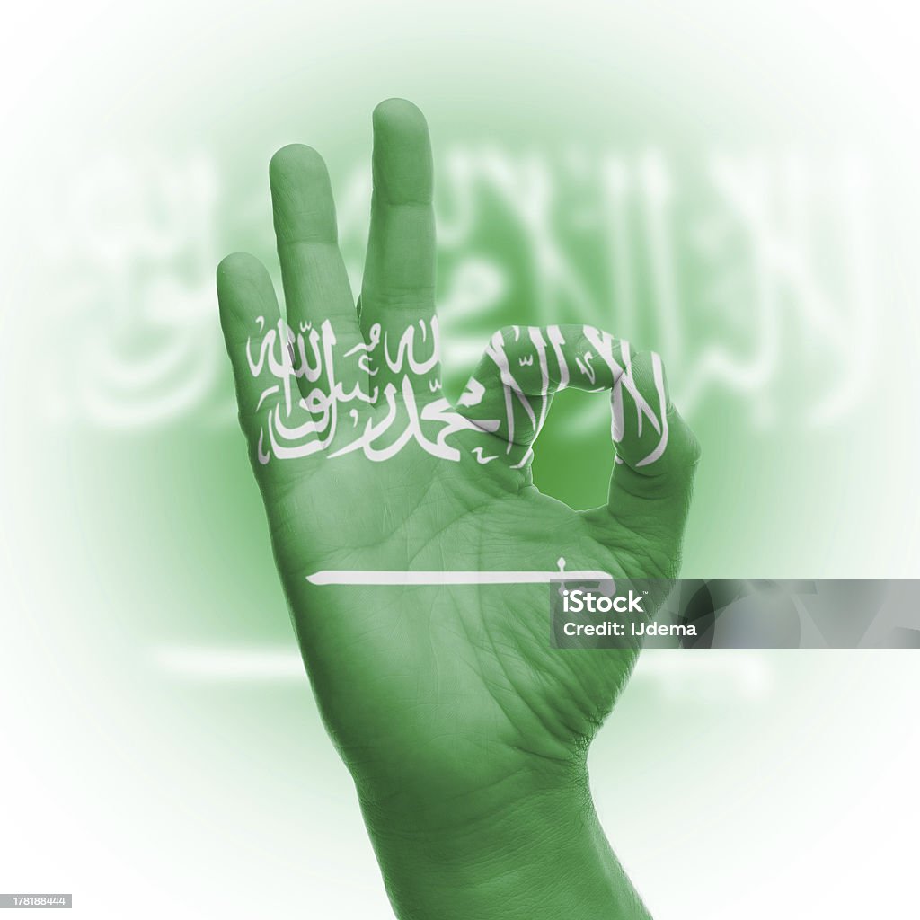 hand OK sign with Saudi Arabian flag hand OK sign, wrapped in the flag of Saudi Arabia Saudi Arabian Flag Stock Photo