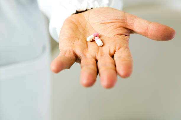 istock Doctor holding pills against anxiety 178188663