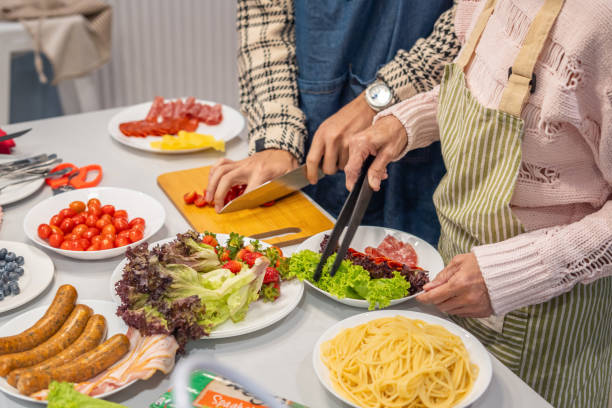 istock Couple making a healthy meal together in their kitchen 1781896543
