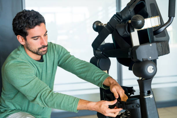 istock Mechanical exoskeleton engineer checking the mechanisms before the arrival of patients. Physiotherapy in a modern hospital 1781907667