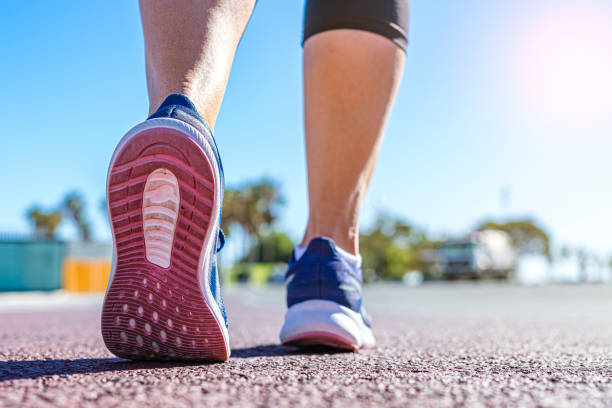 istock Rear view of runner shoes on a running track 1781919735