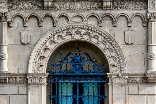 Stone wall with arched door in Seville