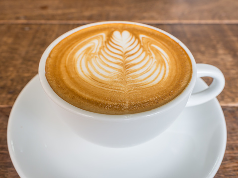 latte art rosetta in a white cup