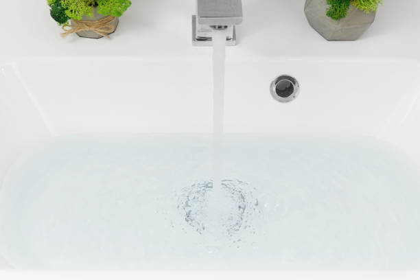 istock Water pouring from a faucet 1781944198