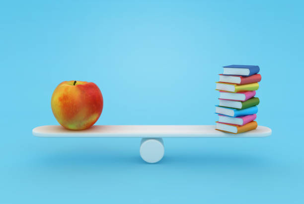 istock Books with Apple on Seesaw 1781952527