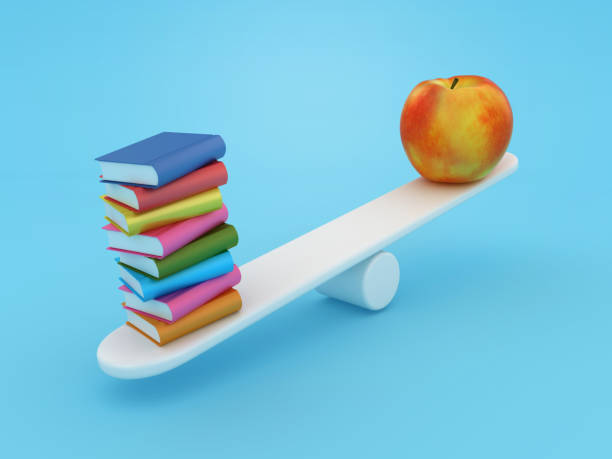 istock Books with Apple on Seesaw 1781953623